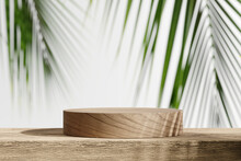 Wooden Product Display Podium With Blurred Tropical Palm Leaves Background. 3D Rendering