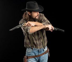 Cowboy with guns. Studio shooting