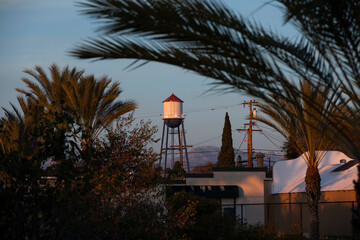 Wall Mural - Sunset twilight view of the historic 1935 water tower of downtown Placentia, California, USA.