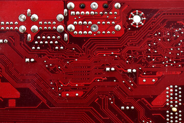 Wall Mural - Red surface of the motherboard chip with connectors