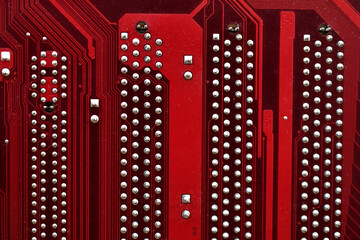 Wall Mural - Red surface of the motherboard chip with connectors