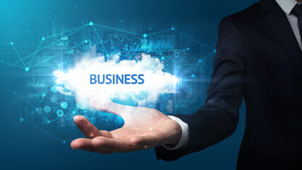 hand of businessman holding motivational message