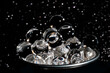© Mauro - Gray caviar cup in glittered black background close-up view
