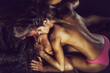 © Volodymyr - Young sexy couple of pretty slim naked woman in panties lying on handsome muscular man. Sensual coupl, nude couples.