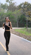 © Prathankarnpap - Portrait of fitness young woman running at the park.