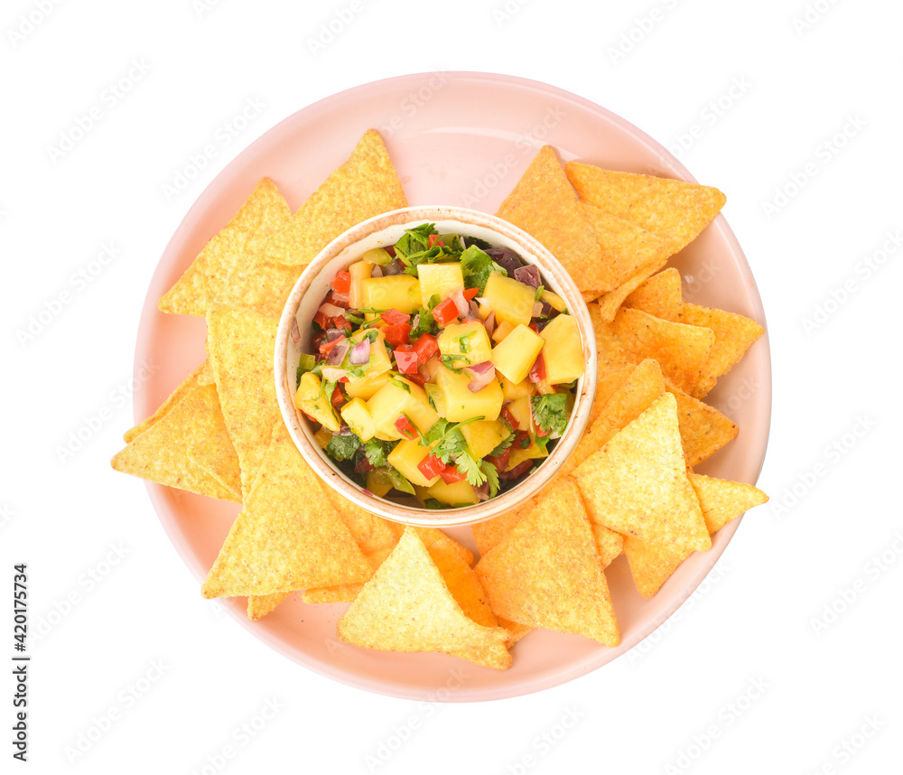 Plate with nachos and fresh mango salsa on white background