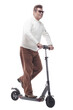 © ASDF - in full growth. casual adult male with electric scooter.