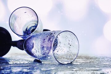 Background with tall glasses for sparkling wines. Champagne and spray in glass glasses. Celebratory drink with reflection.