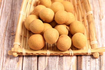 Poster - Longan is on the wooden table