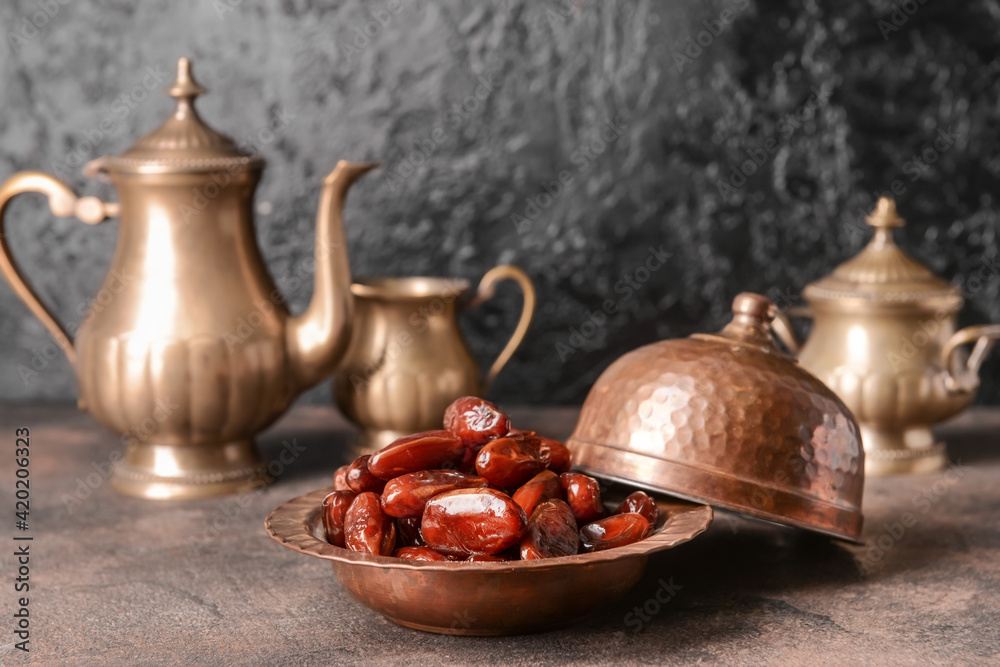 Composition with sweet dried dates on grunge background