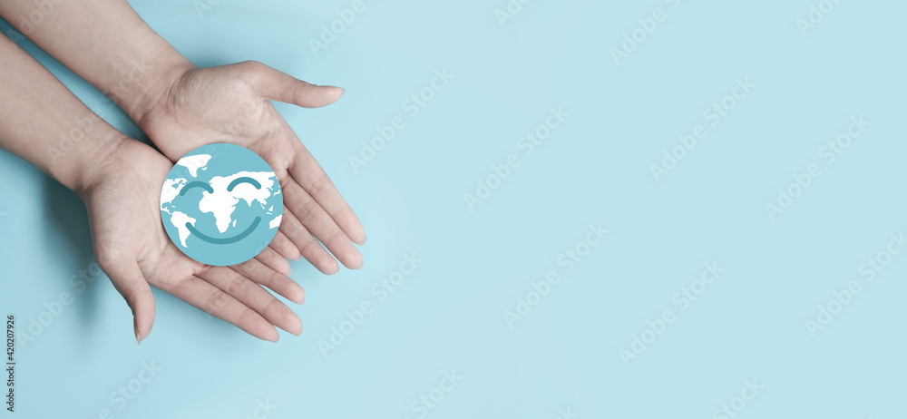 Hands holding smile earth paper cut, save planet, earth day, sustainable living, ecology environment, climate emergency action, world environment day concept, illustration for global warming content - obrazy, fototapety, plakaty 