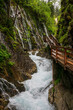 A lot of Waterfalls in the Wimbacklamm in Bavaria Berchtesgaden with stones and green plants and trees