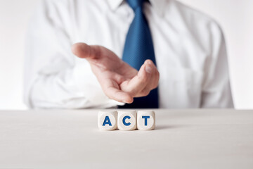 Wall Mural - Hand of a businessman presenting the wooden cubes with the word act. Time to take action in business