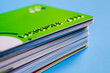 Stack of plastic credit cards on blue background. Banking and finance concept
