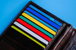 © Proxa Videx - Leather wallet with plastic credit cards on blue background. Banking and finance concept
