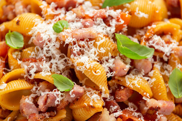 Wall Mural - Conchiglie alla Amatriciana pasta with pancetta bacon, tomatoes and pecorino cheese. Healthy Italian food