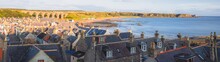 Scenic Panorama Townscape View Of The Quaint Seaside Fishing Village Of Cullen Bay And Viaduct During Summer In Moray Scotland.