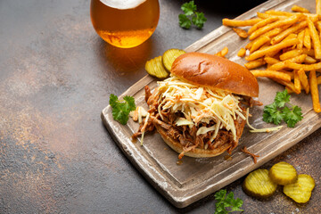 Wall Mural - Homemade BBQ Pulled Pork burger with coleslaw, fries and beer