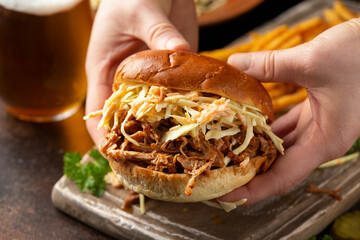 Wall Mural - Homemade BBQ Pulled Pork burger with coleslaw, fries and beer