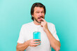 © Asier - Middle age dutch man sitting holding a mouthwash isolated on blue background relaxed thinking about something looking at a copy space.
