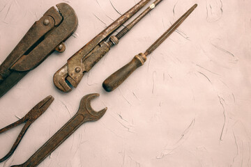 Fathers day or labor day greeting card concept. Vintage old tools on grey concrete background. Copy space