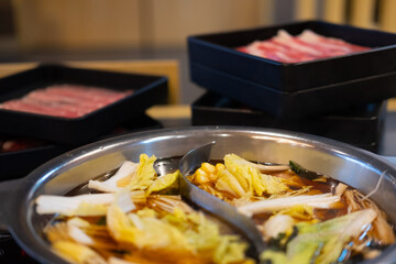 Wall Mural - Shabu-shabu, thin slices of beef and many vegetable in hot soup