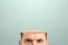 Close-up Of A Man's Head Cut Off From The Crown, No Brain. Vacuum In The Human Head. Creative Background.