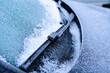 Frozen windshield wipers in winter, close-up