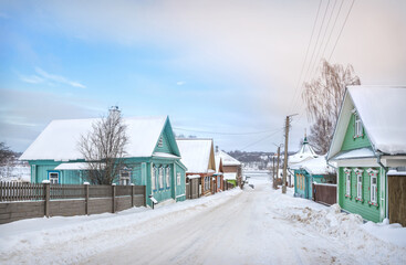 Wall Mural - Wooden houses on Nikolskaya Street and a view of the frozen Volga in Plyos