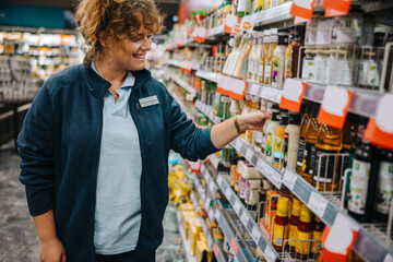 Wall Mural - Woman working in supermarket