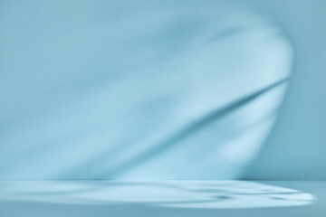 Abstract blue background with drop shadow and light. Backdrop for product presentation