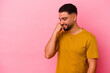 © Asier - Young mixed race man isolated on pink background