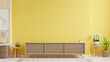 Cabinet TV in modern living room with lamp,table,flower and plant on yellow wall background.