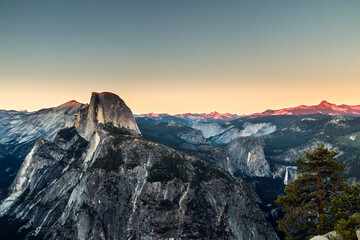 Wall Mural - summer dusk in Glacier Point in Yosemite National Park. The Half Dome can be seen in this elevated vantage point.