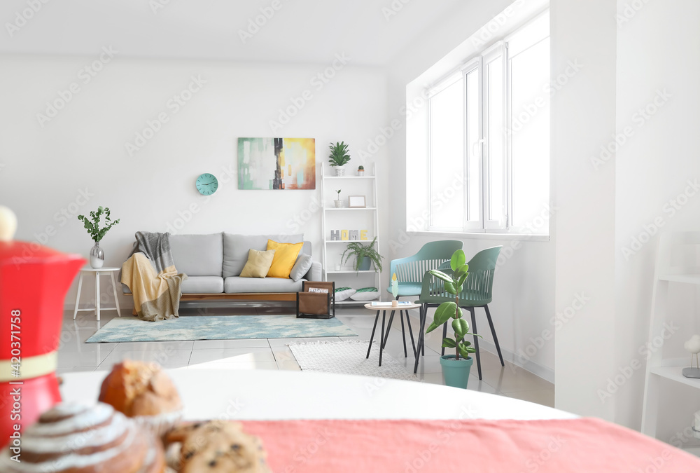Stylish interior of living room with comfortable sofa