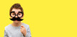 Funny happy boy with black hipster mustache and glasses, child pretends to be dad, professor or nerd on yellow banner background, Fathers Day, mens health, smart kids, joke, emotion, copy space