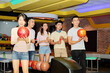 © DragonImages - Group of Asian friends playing bowling together in entertainment center