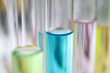 Test tube with liquid on chemistry lab table closeup