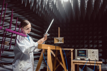 Engineer in electronics lab performing rf compliance test