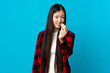 © luismolinero - Young Chinese girl over isolated blue background making money gesture