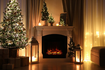 Sticker - Beautiful fireplace, Christmas tree and other decorations in living room at night. Interior design