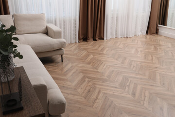 Modern living room with parquet flooring and stylish furniture