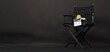 BLACK director chair with Clapperboard or movie Clapper board and megaphone on black background.it use in video production or film and cinema industry.