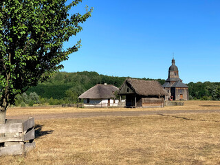 Mykolaiv 18th century church, an architectural monument of Ukraine, Authentic Cossack farm in Stetsivka village in Сherkasy region. Cossack wooden church in the village. Soft focus, mobile photo