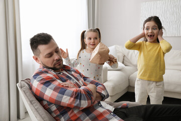 Sticker - Cute little children popping paper near father while he sleeping at home