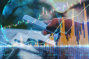 Poster - Worldwide stock market system concept with financial chart graphs and diagram and man hand with modern cell phone