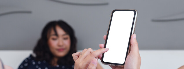 Poster - woman finger touch on smartphone blank white screen. mockup empty of telephone use for text and graphic.