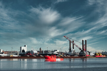 Wall Mural - Oil and Wind power rigs in Esbjerg harbor. Denmark