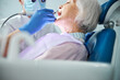 Dental specialist taking care of retired person tooth