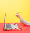 © French Anderson Ltd/Stocksy - Frustrated hand clutching a broken and chewed pencil